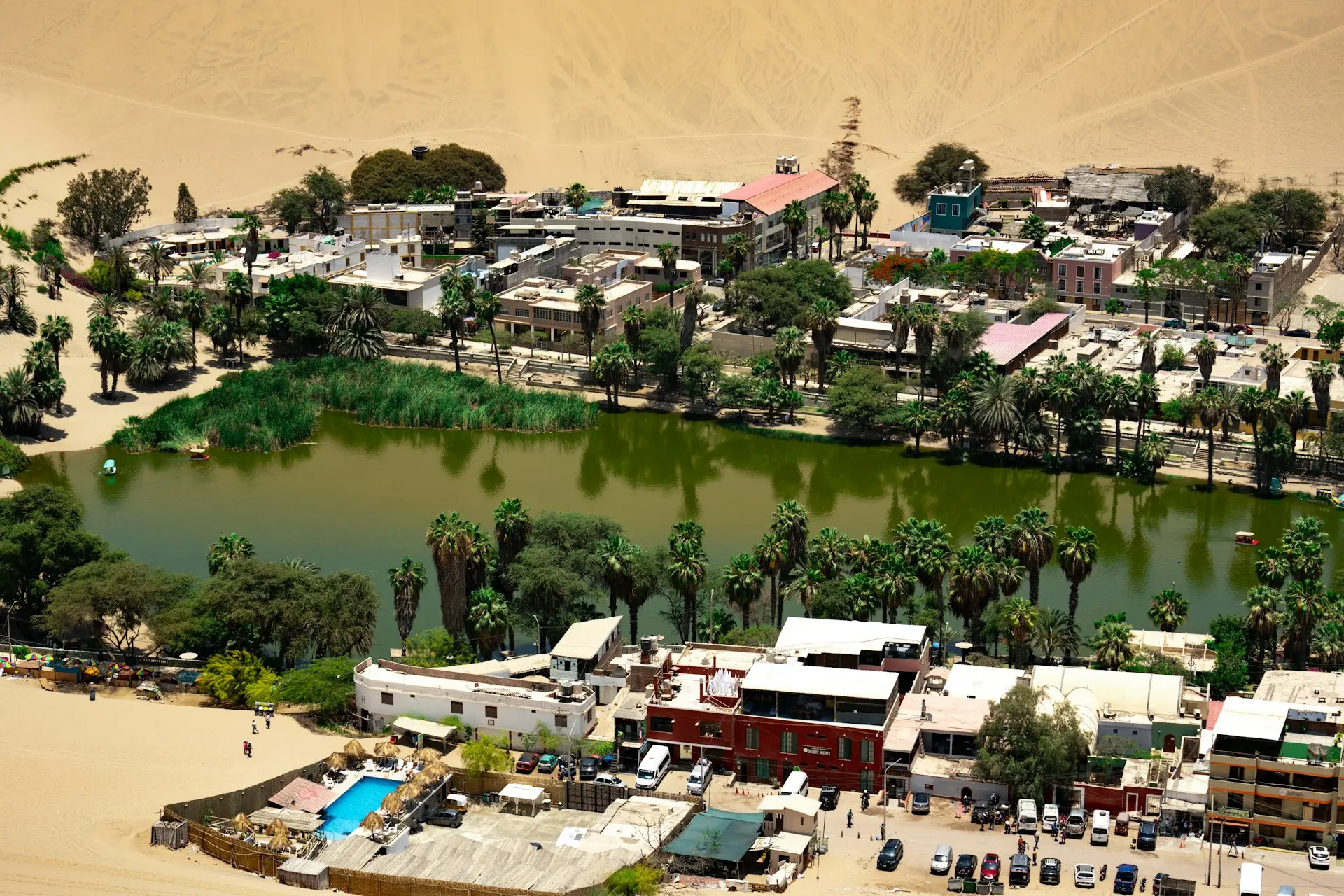 An aerial view of a small town and a lake